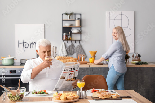Happy elderly couple having...