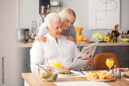 Happy elderly couple having...