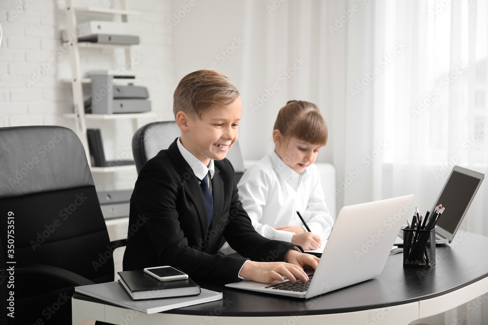 Fototapeta premium Little secretaries working in office