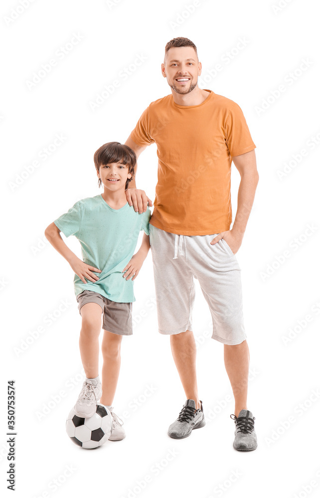 Father and little son with soccer ball on white background