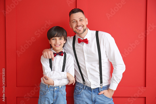 Stylish father and little s...