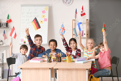 Little children during lesson at language school photo