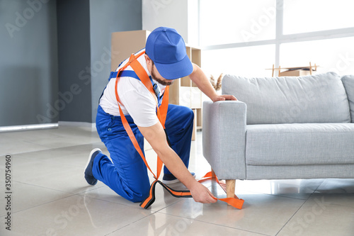 Loader using cargo belts for carrying furniture