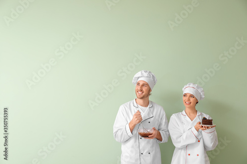 Young confectioners with ta...