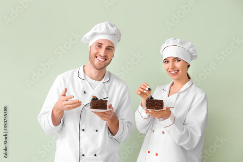 Young confectioners with ta...