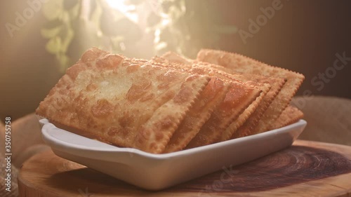 Fried pastry on a plate with different flavors photo