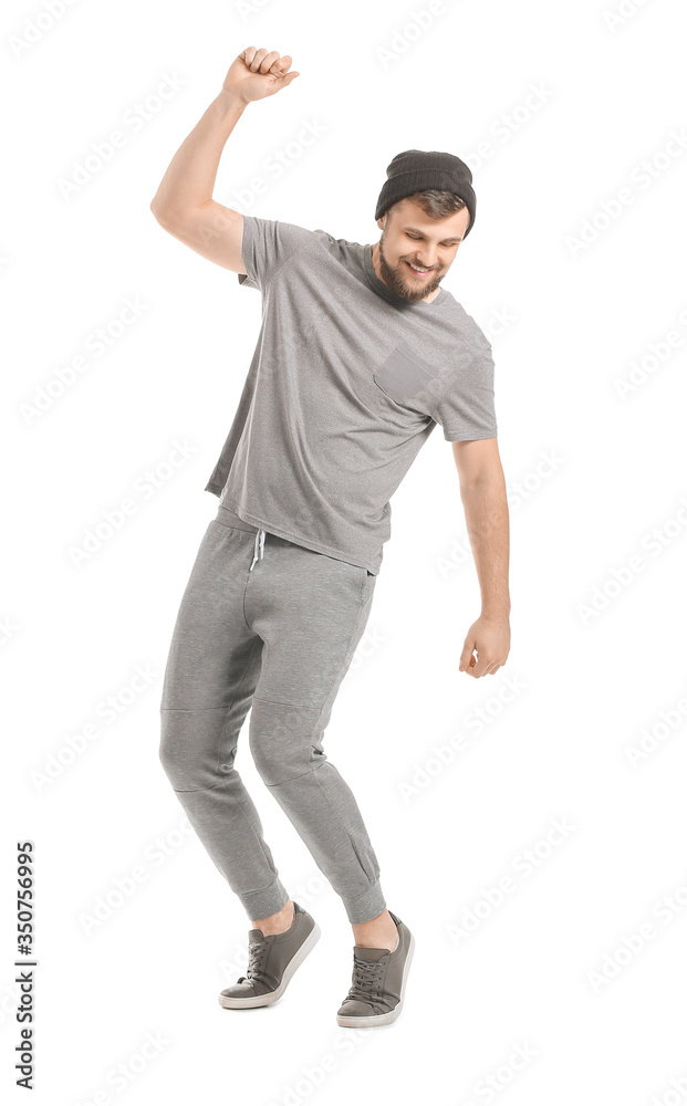 Handsome young man dancing against white background Handsome young man dancing against white background