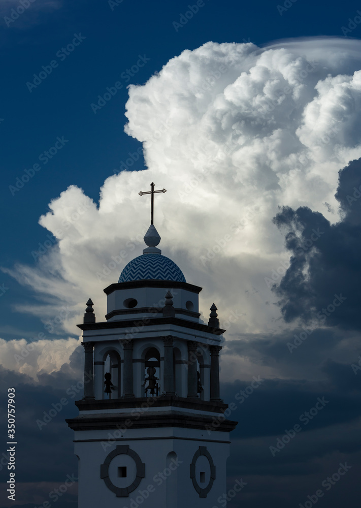 Church cross and clouds Guatemala City