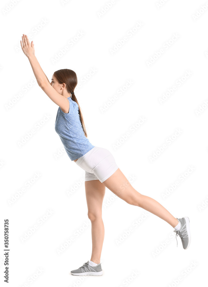 Sporty young woman training against white background Sporty young woman training against white background