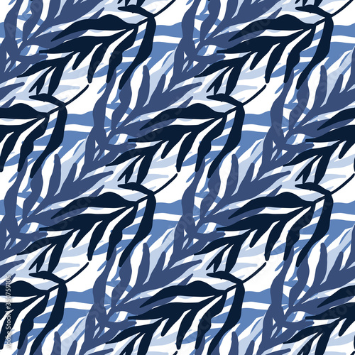 Abstract jungle plants leaves seamless pattern in blue colors. Trendy tropical leaf wallpaper. © smth.design