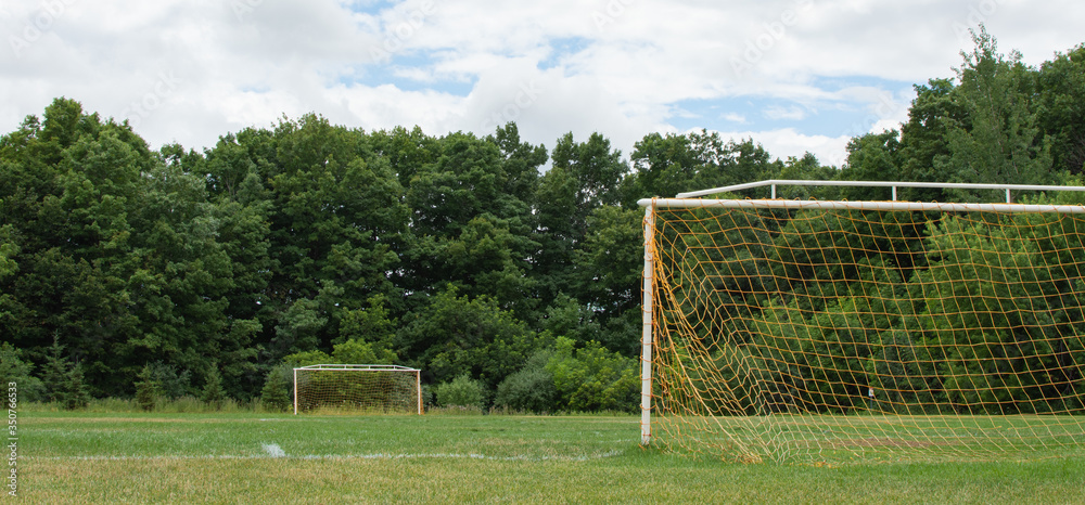 Image of a Soccer Field with Two Goal Posts during Summer at a park