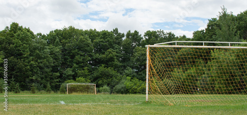 Image of a Soccer Field with Two Goal Posts during Summer at a park