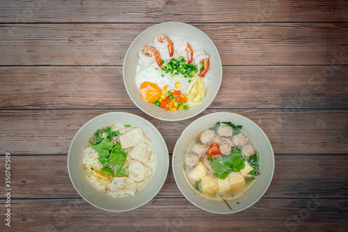 Top view composition with Thai Food. Congee shrimp, Thai Rice Soup and Clear Soup with Tofu and Minced Pork
