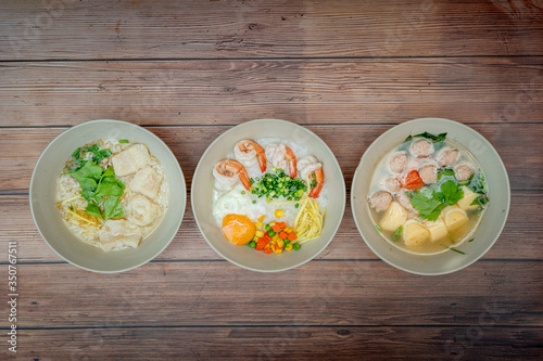 Top view composition with Thai Food. Congee shrimp, Thai Rice Soup and Clear Soup with Tofu and Minced Pork