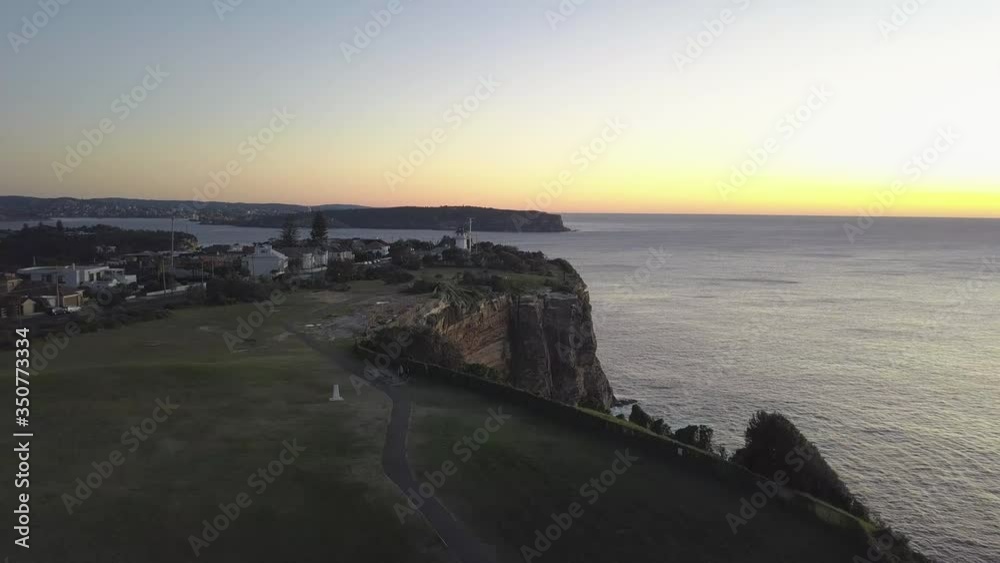 Flying above sydney's sandstone cliffs towards a beautiful sunrise. Eastern Suburbs SYD Australia Flying above sydney's sandstone cliffs towards a beautiful sunrise. Eastern Suburbs SYD Australia