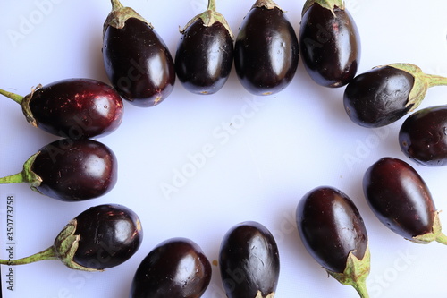 Fresh Raw Sliced Purple Eggplant Brinjal or Eggplant isolated on white background   