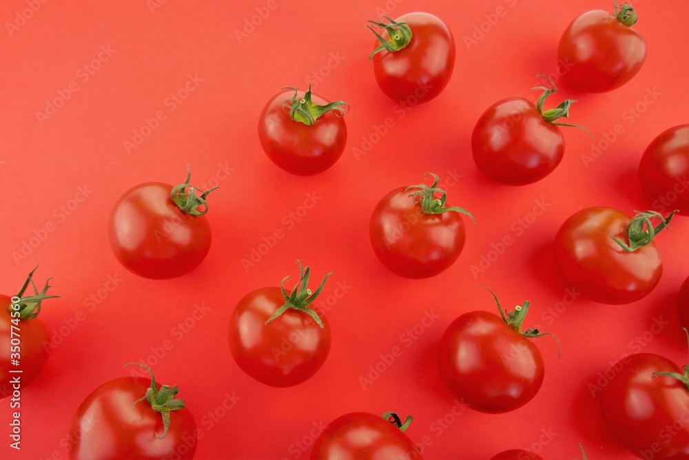 Tomato pattern. Tomato background. Red ripe tomatoes on a red background. Tomatoes season vegetables. Farm organic vegetables Tomato pattern. Tomato background. Red ripe tomatoes on a red background. Tomatoes season vegetables. Farm organic vegetables
