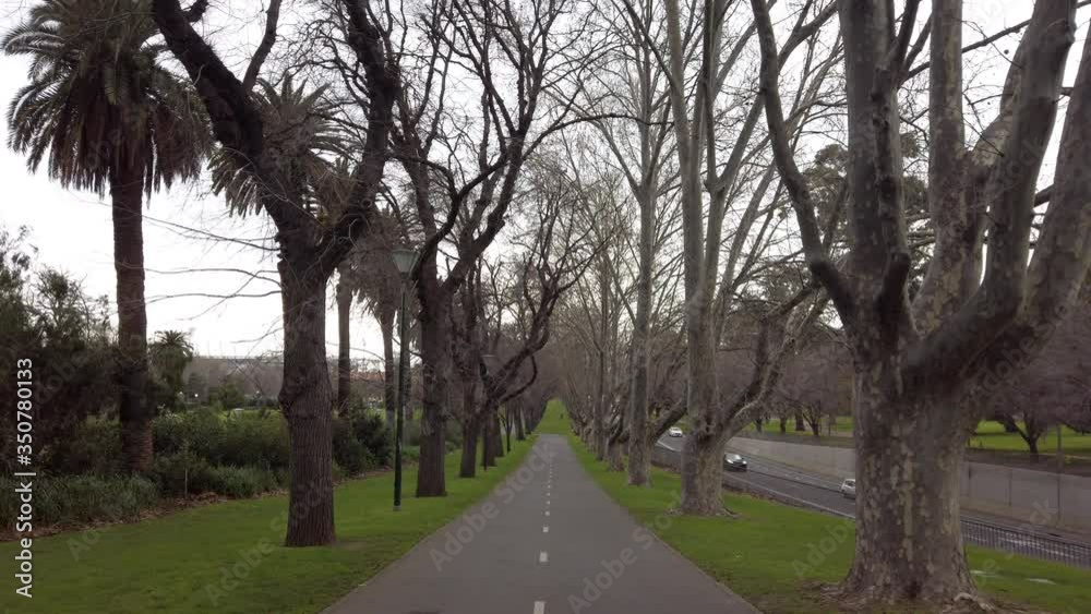 Quiet walkway during an overcast day in Melbourne, empty bike lane, no people Quiet walkway during an overcast day in Melbourne, empty bike lane, no people
