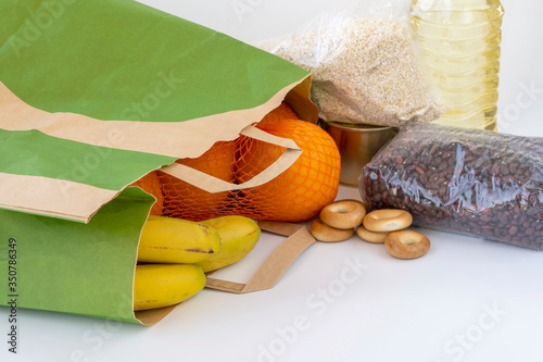 food donations in a paper bag. vital food items during the quarantine coronavirus Covid-19.