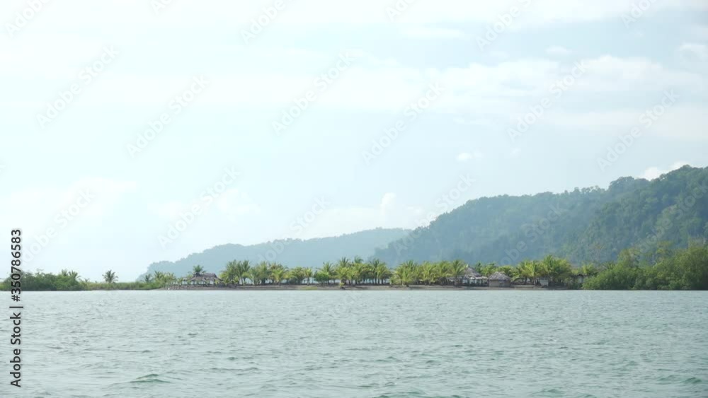 Golfito Bay with Palm Tree Peninsula and Low Mountains in the Background on Clear Sunny Day in Costa Rica Golfito Bay with Palm Tree Peninsula and Low Mountains in the Background on Clear Sunny Day in Costa Rica