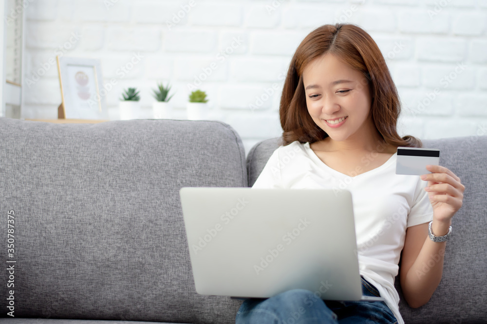 Beautiful young woman is happy to enjoy shopping online at home. Beautiful young woman is happy to enjoy shopping online at home.