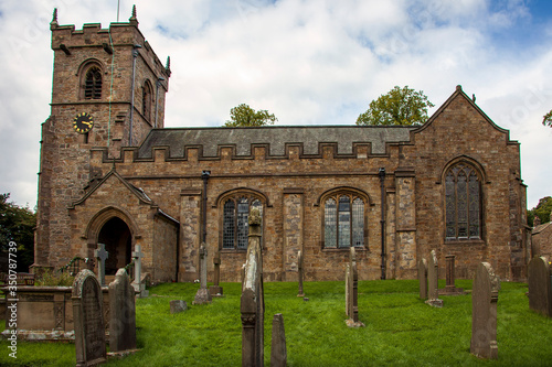 An ancient stone church and graveyard hold countless secrets in picturesque Downham Village, England.