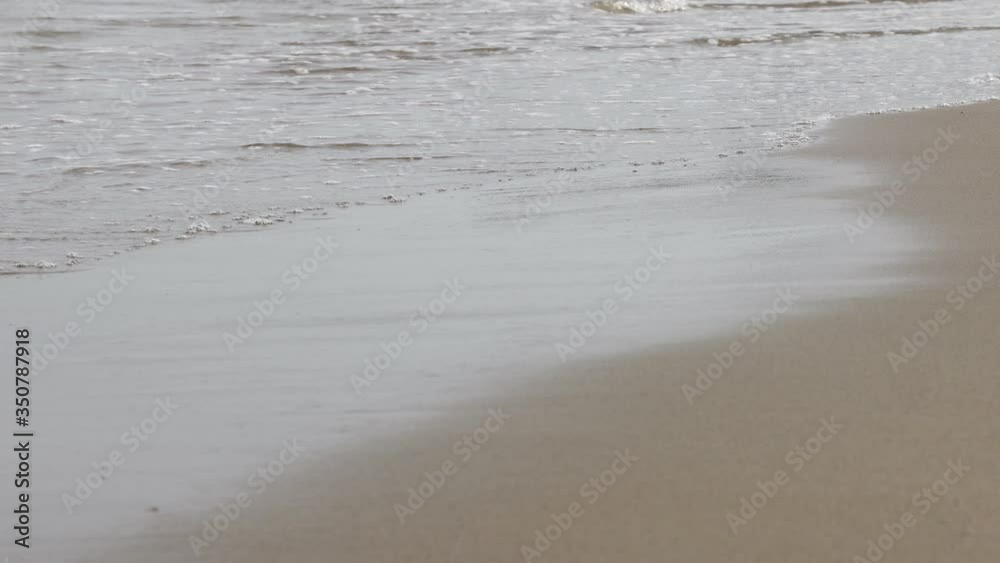 Soft ocean wave on sandy tropical beach. Soft ocean wave on sandy tropical beach.