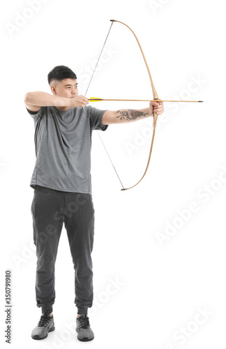 Handsome Asian archer with bow on white background
