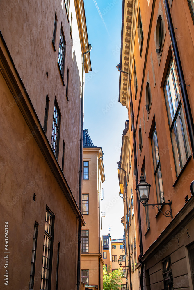 Beautiful, Traditional Swedish Buildings Line a Narrow Alley in the Gamla Stan Neighborhood of Stockholm, Sweden
