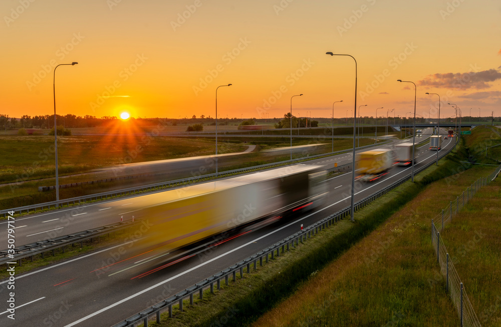 heavy truck traffic on the highway in the evening