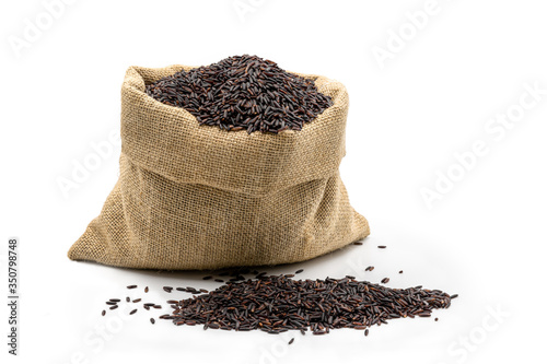 Rice berry in sack on white background.food for diet and healthy concept