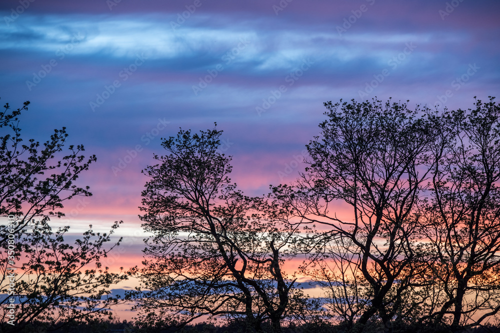 Sunset orange blue sky with clouds background Sunset orange blue sky with clouds background