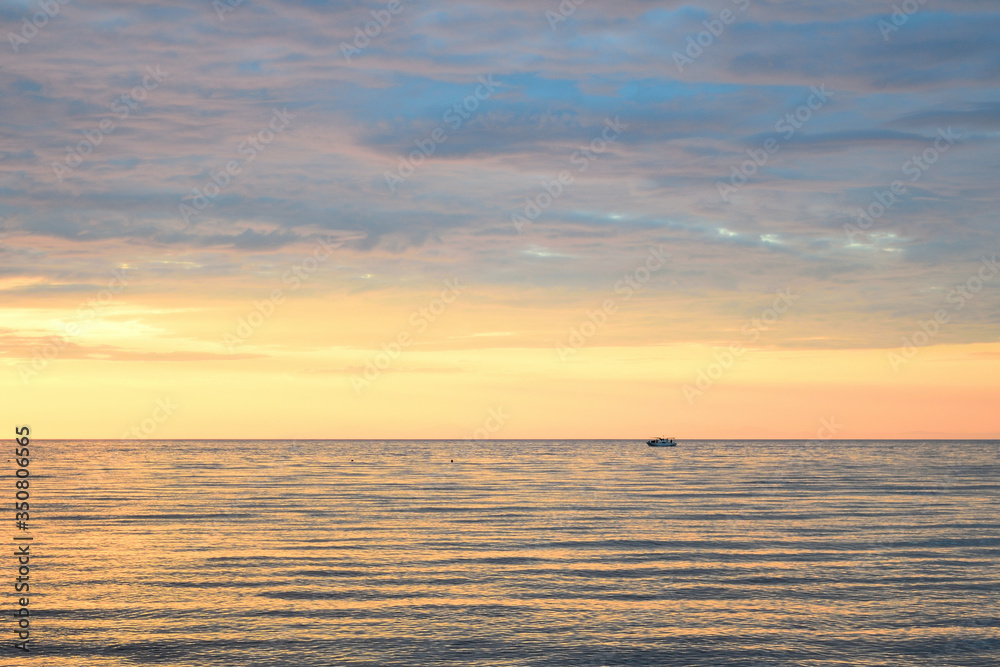 Fototapeta premium Cloudy sunset over the sea at Therma beach – Samothraki island, Greece, Aegean sea