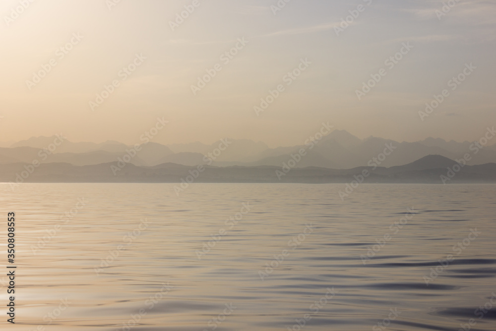 The sea at dawn. Background mrsky landscape. Calm ocean.