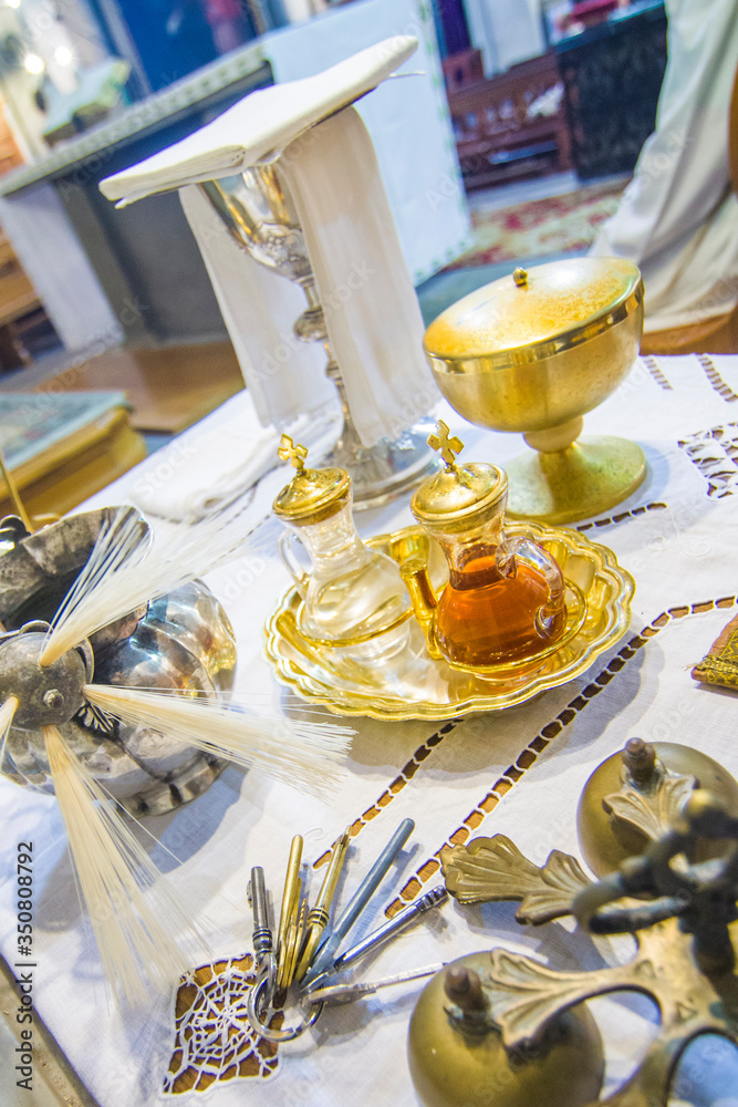 chalice for wine, blood of christ, and ciborium with host, body of christ, and ampoules with wine and water for consecration chalice for wine, blood of christ, and ciborium with host, body of christ, and ampoules with wine and water for consecration