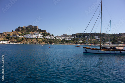 Lindos Village in Rhodes, Greece - 07/07/2018 : view of a yacht in the sea. © Irida