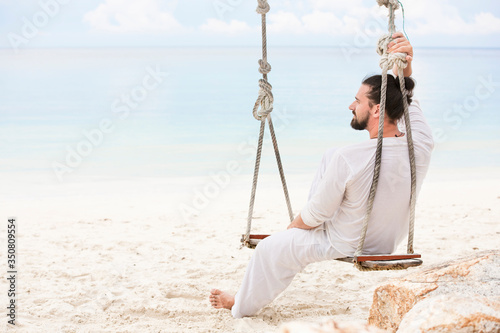 Businessman freelance on beach dreaming. Sand beach