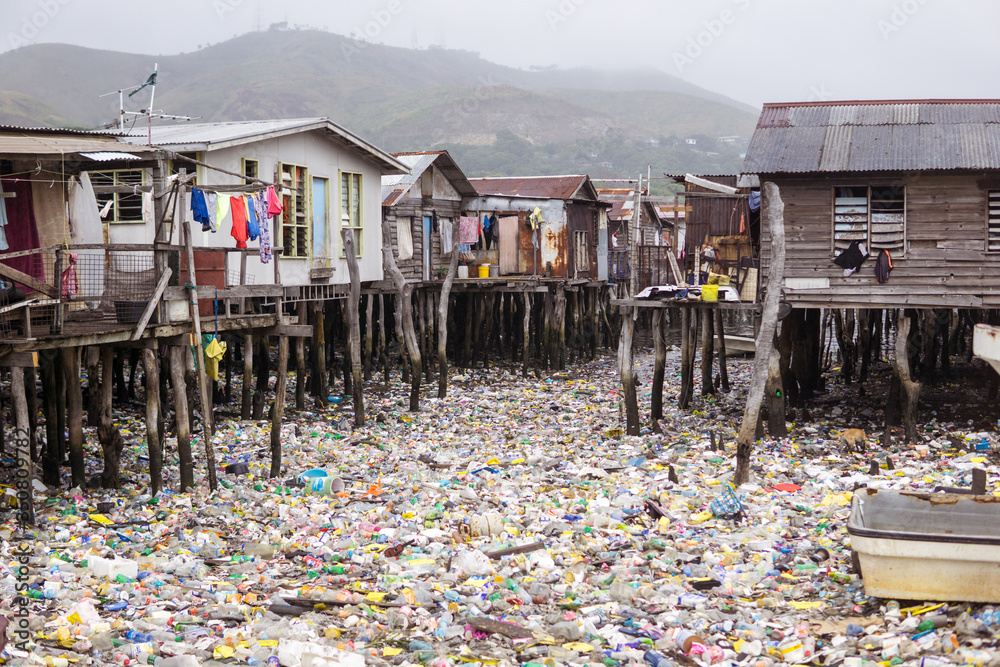 Waters filled with plastics in floating wooden village on the coast of Port Moresby, the capital of Papua New Guinea