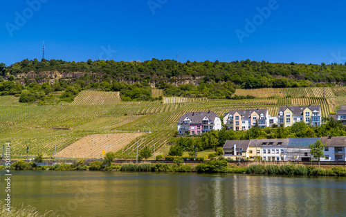 Houses and apartments in the town of Nittel, Germany with vineyards on the Moselle river