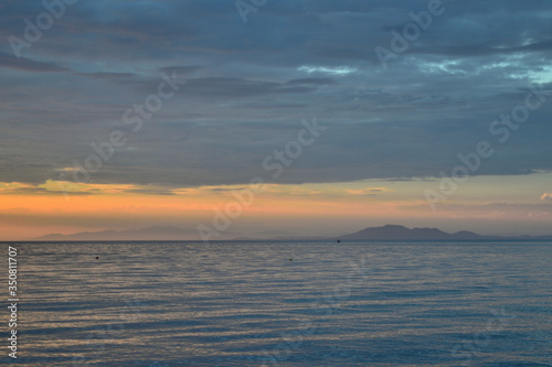 Cloudy sunset over the sea at Therma beach - Thassos at horizon     Samothraki island  Greece  Aegean sea