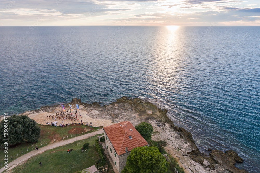 People training dancing on seaside in Croatia aerial drone photo