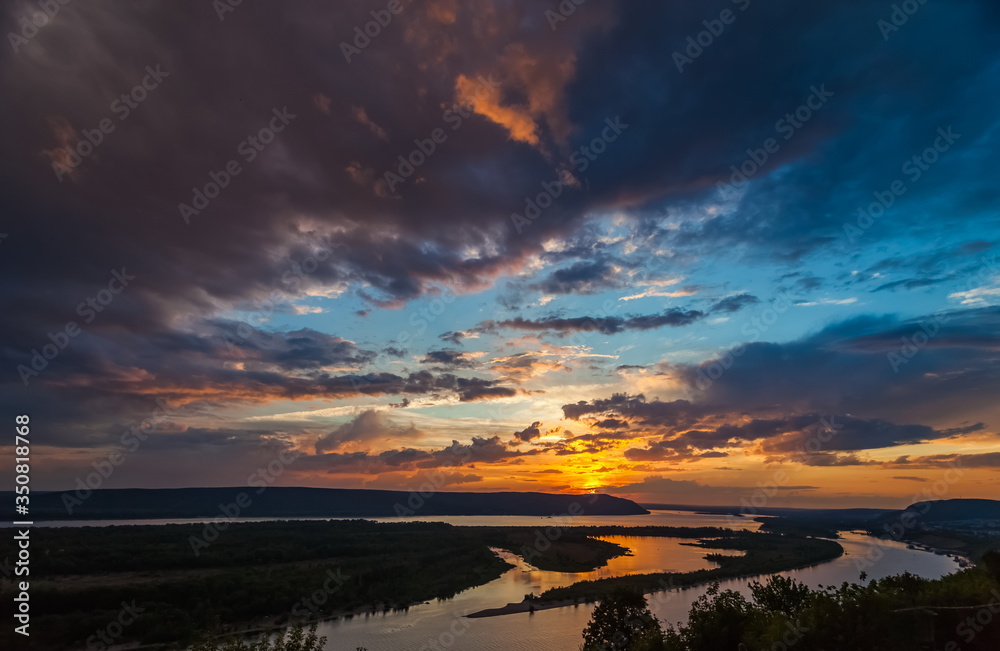 Landscape with sunset on the river in summer