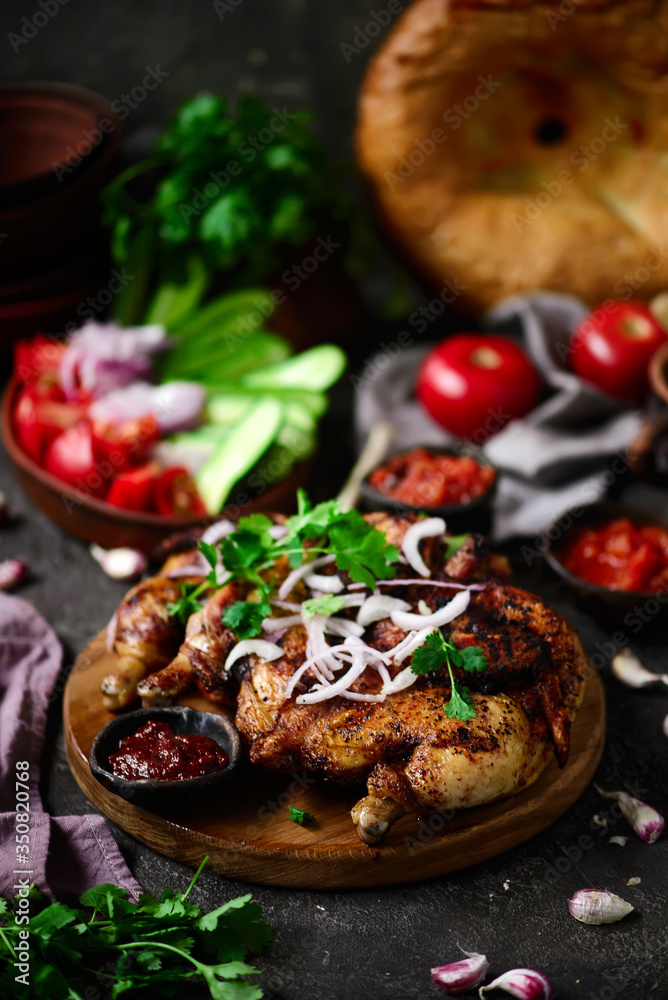 Chicken Tabaka.traditional Georgian dish .selective focus