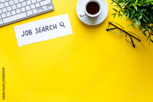 Job search. Yellow office desk form above space for text. Hiring concept