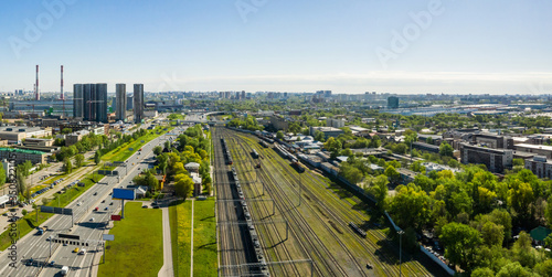 Aerial top view of road junction in Moscow from above, automobile traffic and the old Ugreshskaya railway station in the Moscow industrial zone near the automobile ring highway photo