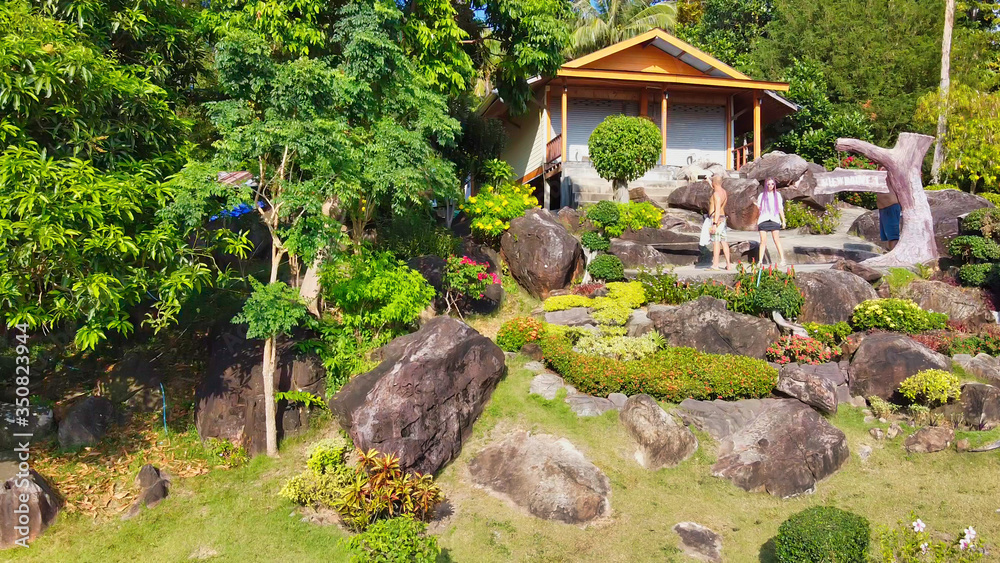 PHI PHI DON, THAILAND - DECEMBER 24, 2019: Tourists visit view point number one on the island hills PHI PHI DON, THAILAND - DECEMBER 24, 2019: Tourists visit view point number one on the island hills