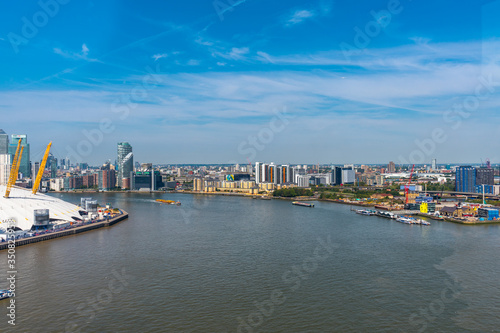 Emirates Air Line cable cars on thames river in London  UK