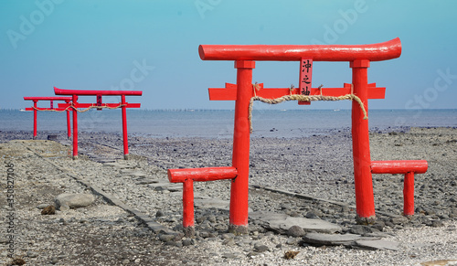 A gateway at the entrance to a Shinto shrine which there is in the Japanese sea