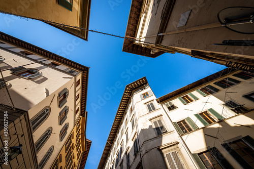 Old houses and buildings in the historic center of Florence photographed from below at a road junction. Tuscany  Italy  Europe