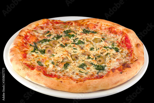 Tasty pizza Verde with tomato sauce, green olives, yellow cheese on a white plate, isolated on black background